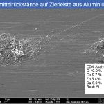 Polishing agent residues on a decorative strip made of an extruded aluminum profile - 02